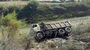 Dalaman'da taşkın sonrası ıslah çalışması sırasında kamyon çaya devrildi