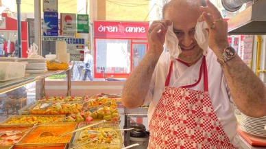 Sıcaktan bunalan aşçı çareyi havluda buldu