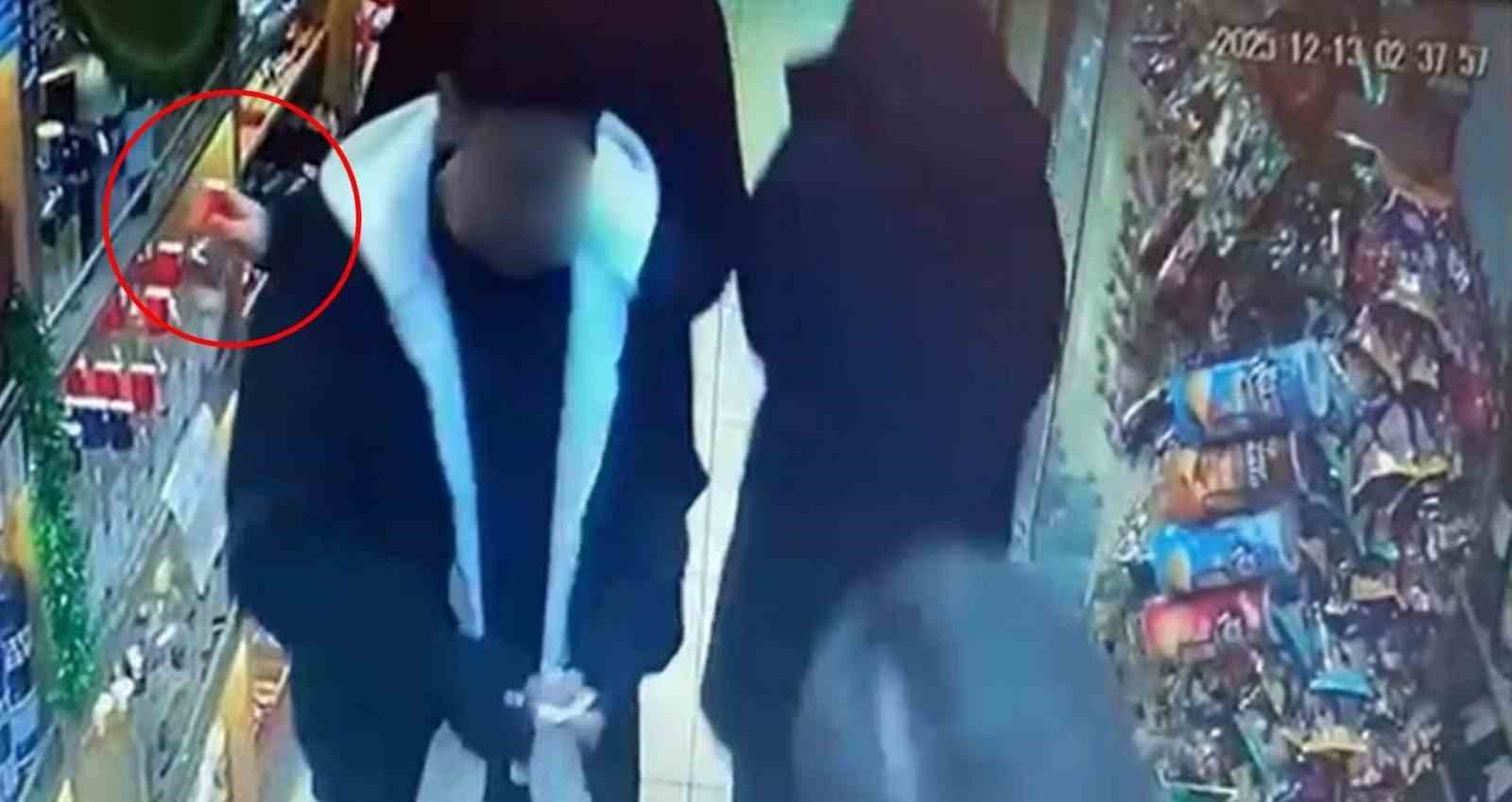 marketten-alkollu-icecek-calan-sahis-kameraya-yakalandi